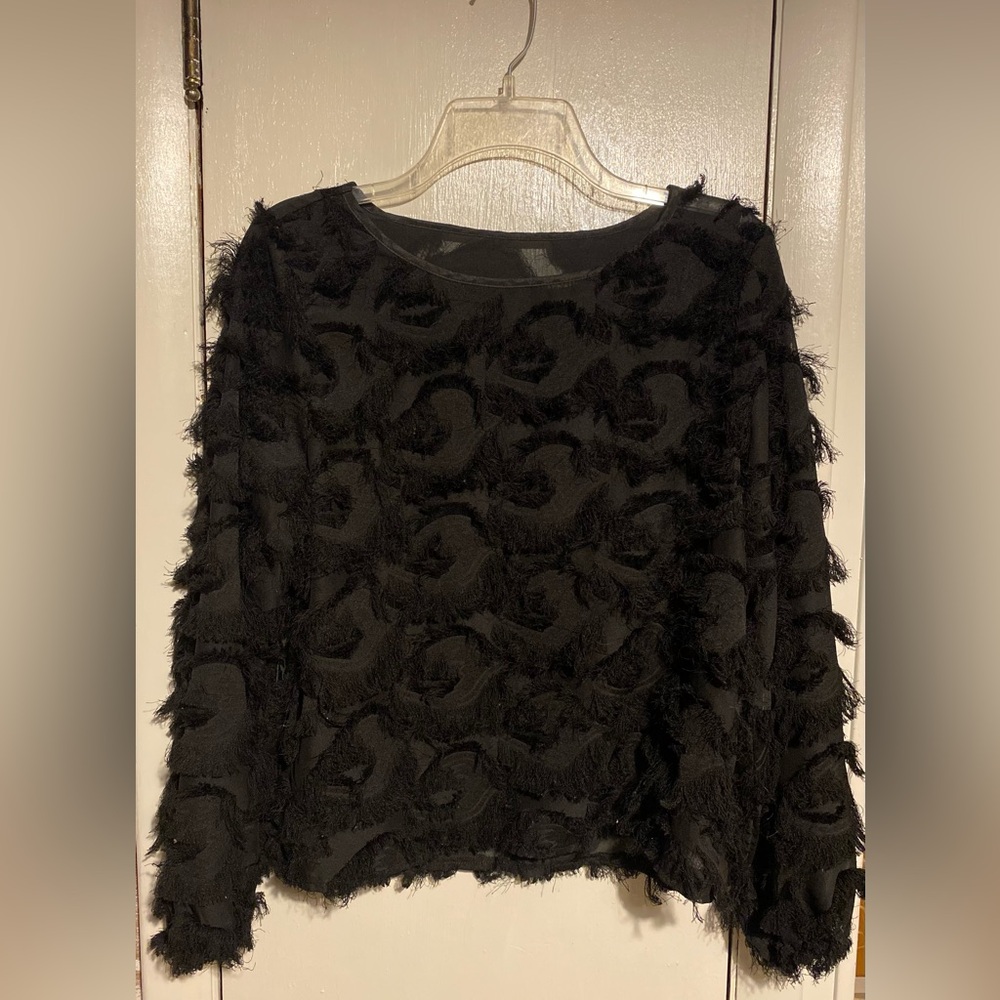 Fuzzy black blouse.